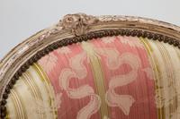A Pair of Louis XV Silk-Upholstered and Painted Bergeres