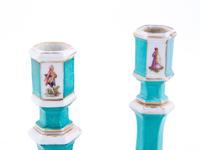 A Pair of Berlin (K.P.M.) Painted and Parcel Gilt Porcelain Candlesticks