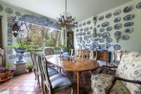 A Pair of Portuguese Tile Urn-Form Wall Appliqu és