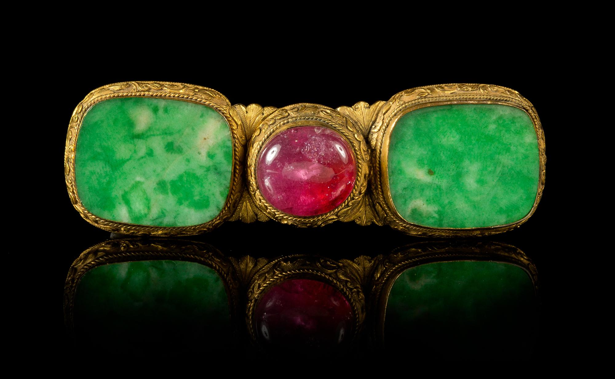A Jadeite and Pink Tourmaline Inset Gilt Bronze Mounted Pendant Length 3 1/2 inches.