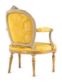 A Matched Pair of George III White-Painted and Parcel-Gilt Armchairs