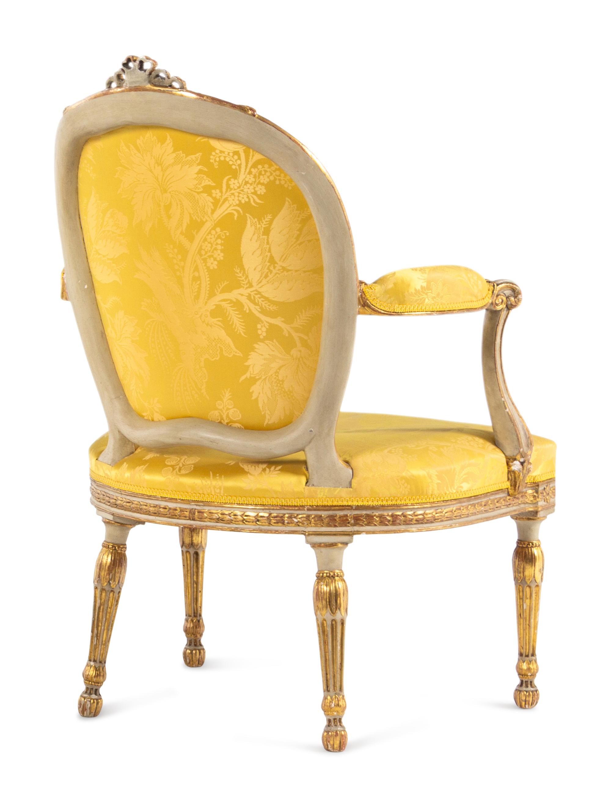 A Matched Pair of George III White-Painted and Parcel-Gilt Armchairs