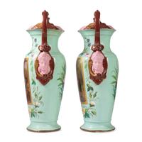 A Pair of Continental Porcelain Urns with Hand Painted and Transfer Decoration