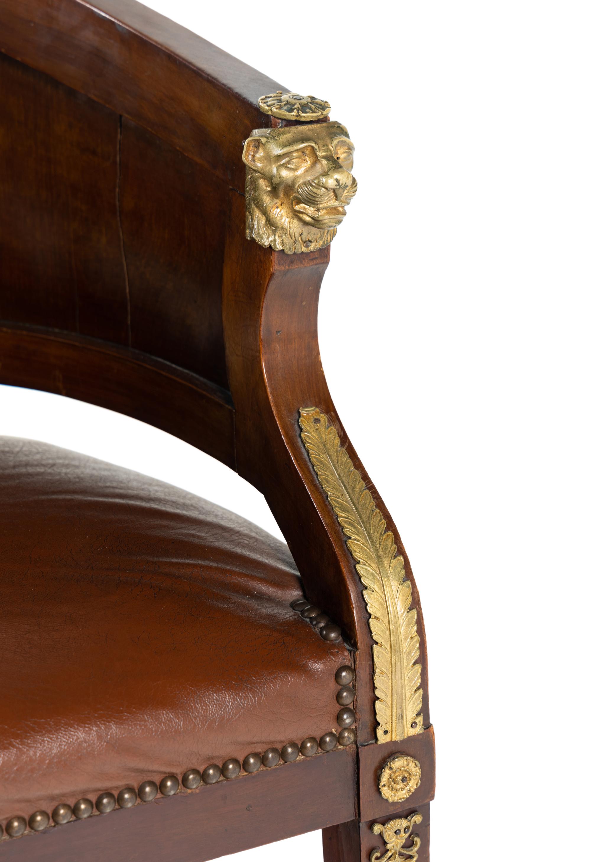 An Empire Style Gilt Metal Mounted Mahogany Bureau Plat and an Associated Armchair