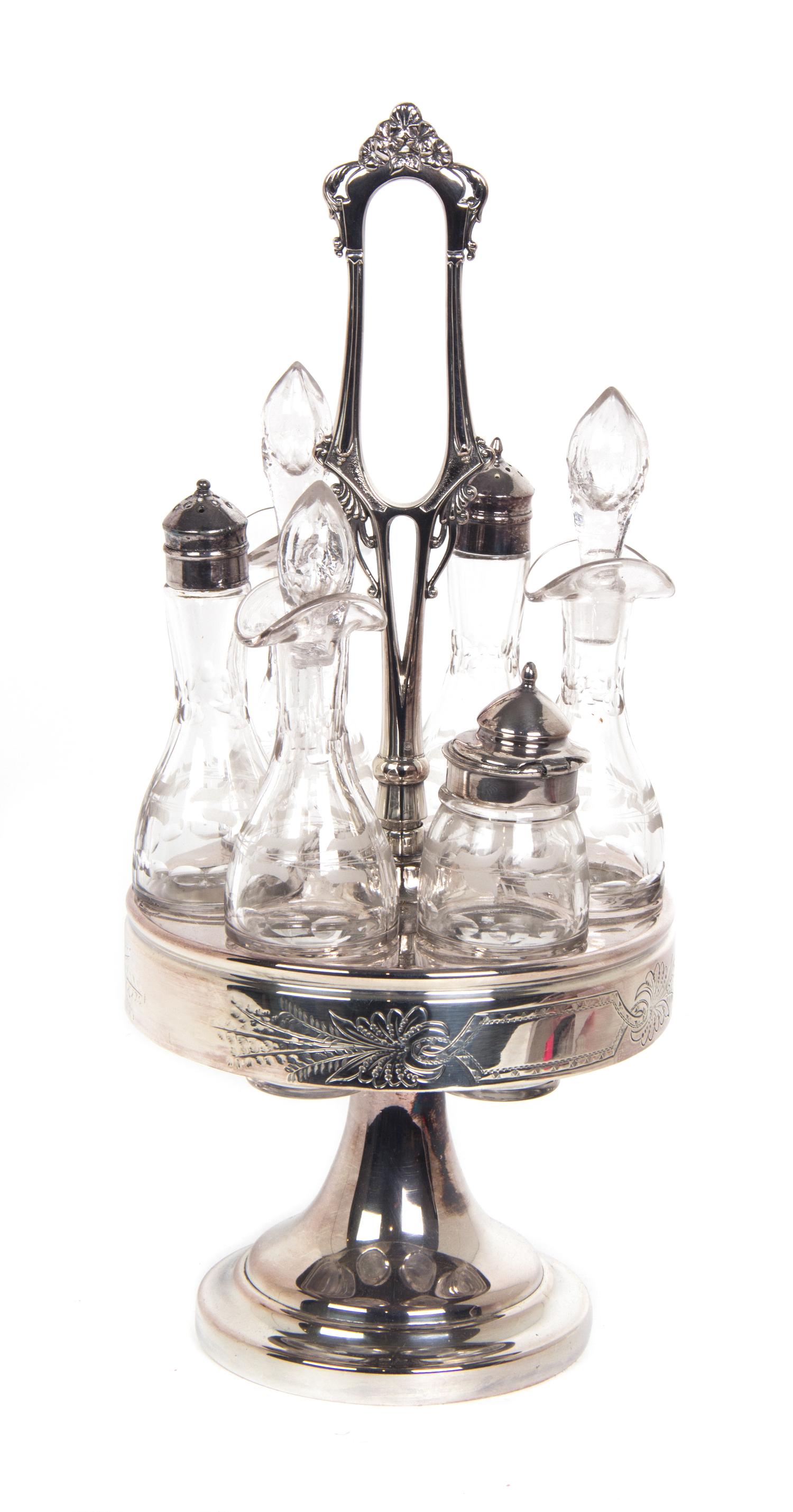 A Silverplate and Etched Glass Cruet Set Height 16 inches.