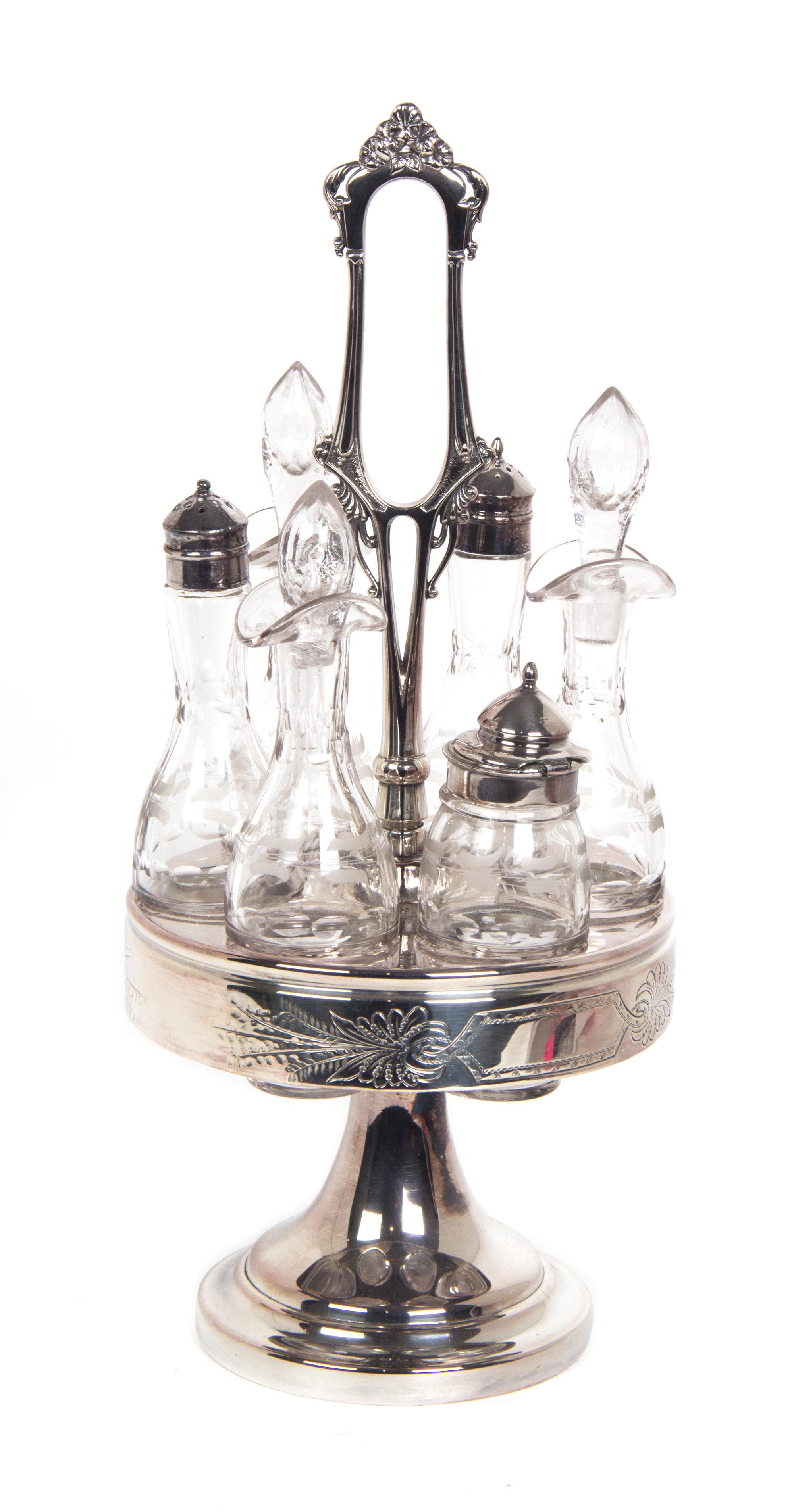 A Silverplate and Etched Glass Cruet Set Height 16 inches.
