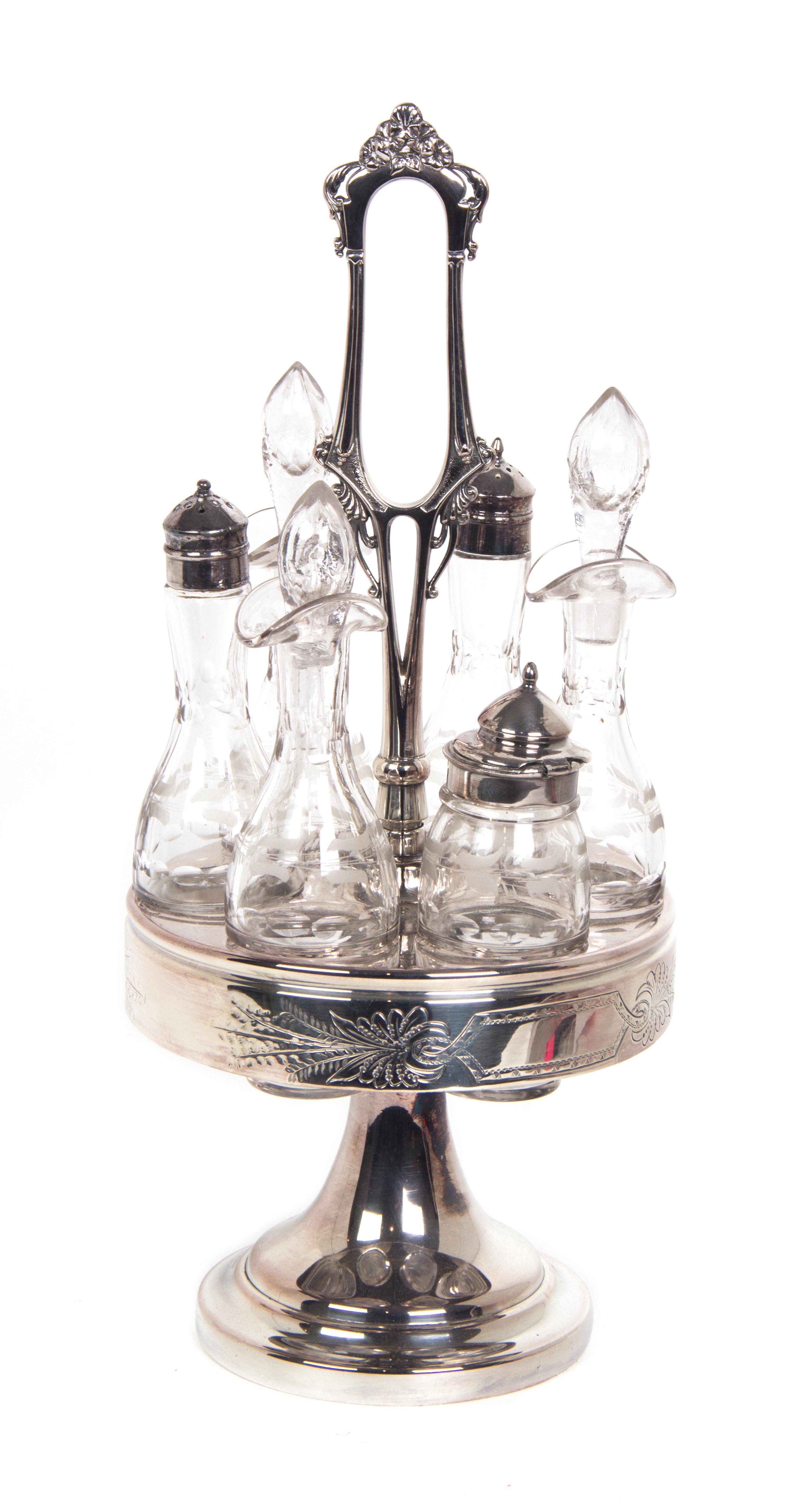 A Silverplate and Etched Glass Cruet Set Height 16 inches.