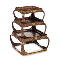A Set of Three Japanese Gilt Decorated Lacquer Nesting Tables