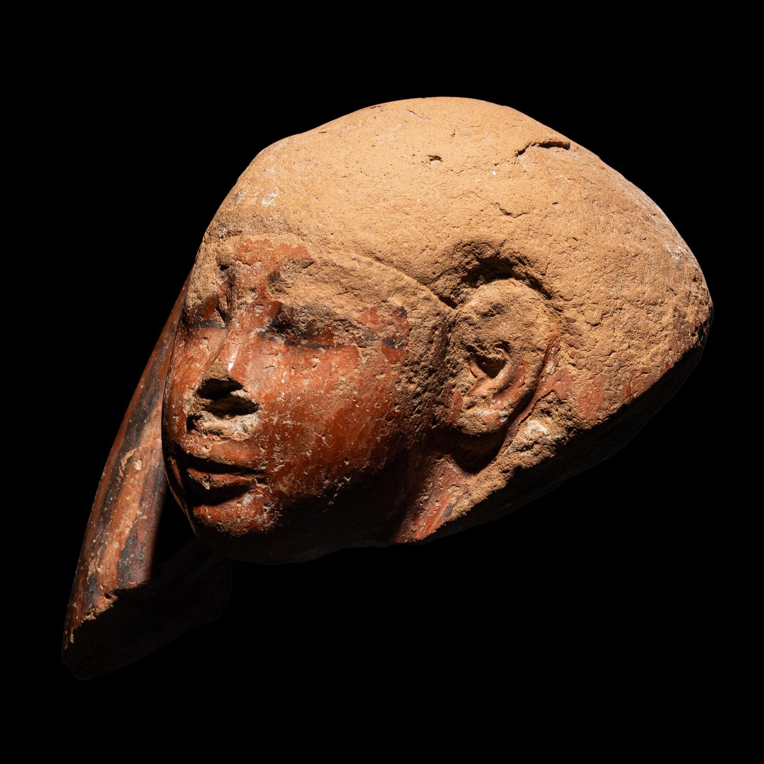 An Egyptian Polychrome Canopic Jar Lid