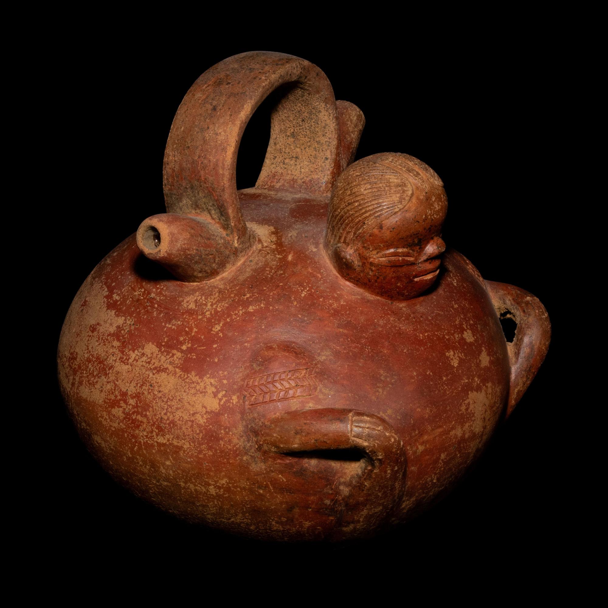 A Calima Redware Anthropomorphic Alcarraza