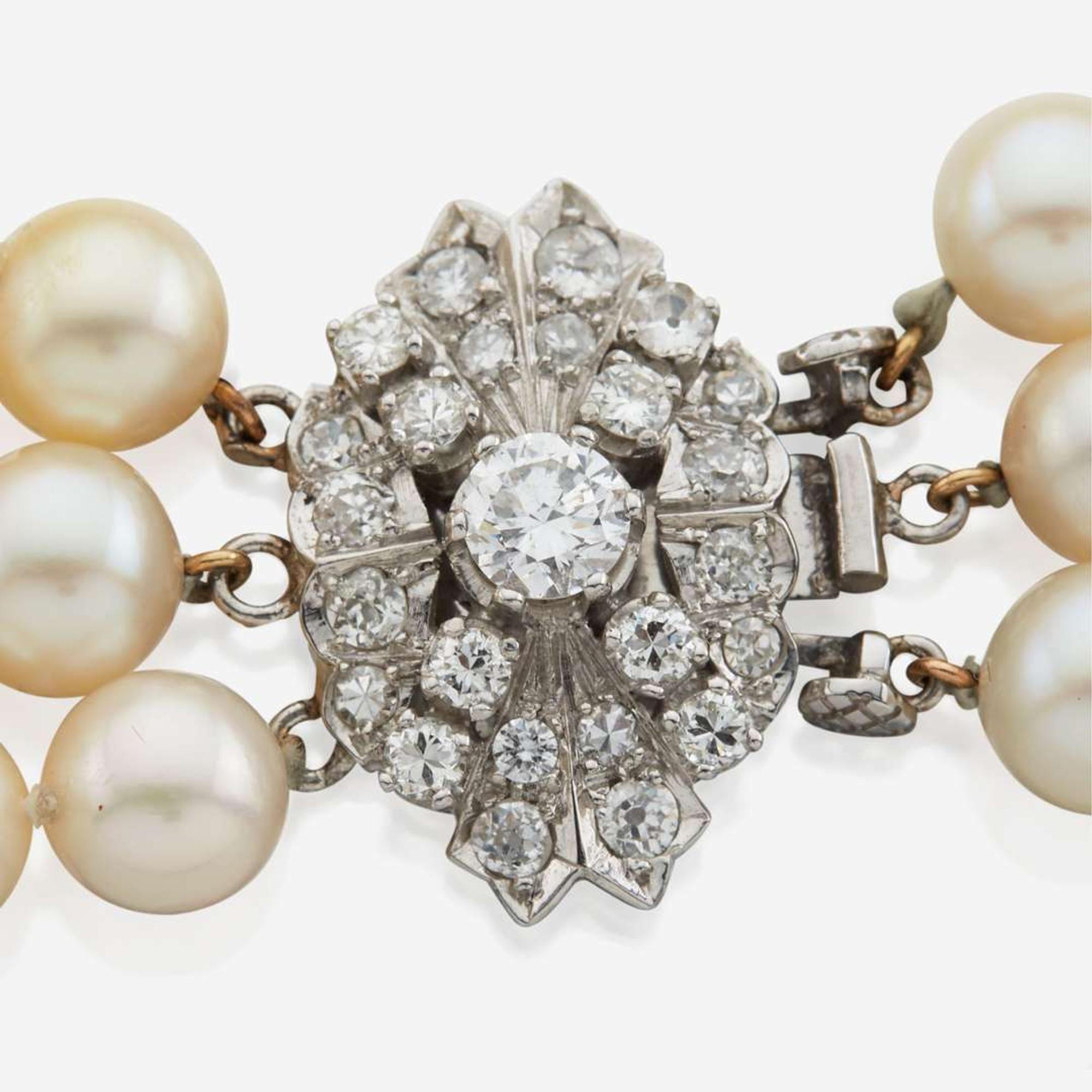 A cultured pearl, diamond, and platinum necklace with similar ear clips