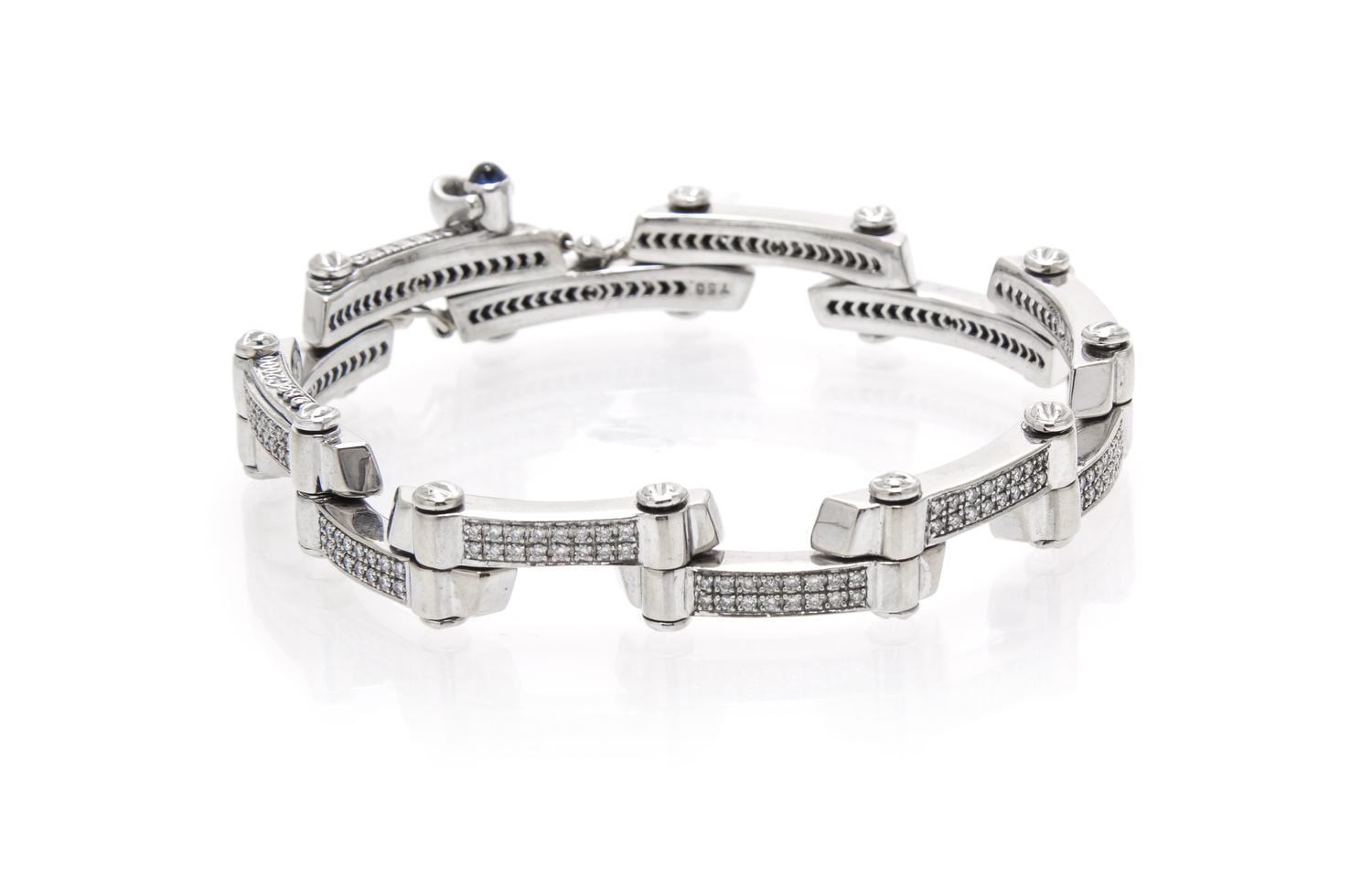 An 18 Karat White Gold, Diamond and Sapphire Bracelet, Charriol, 25.30 dwts.