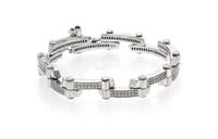 An 18 Karat White Gold, Diamond and Sapphire Bracelet, Charriol, 25.30 dwts.