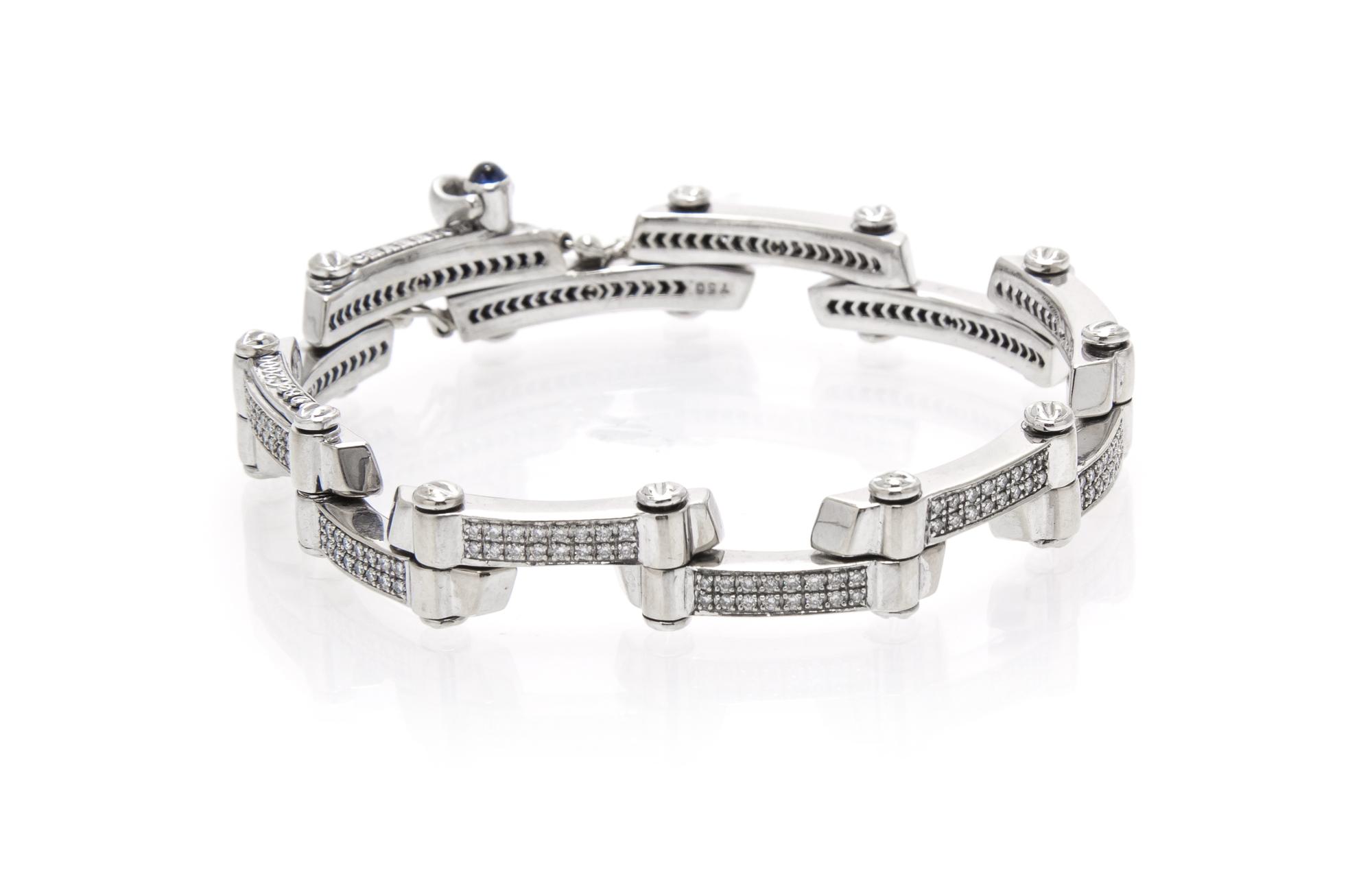 An 18 Karat White Gold, Diamond and Sapphire Bracelet, Charriol, 25.30 dwts.