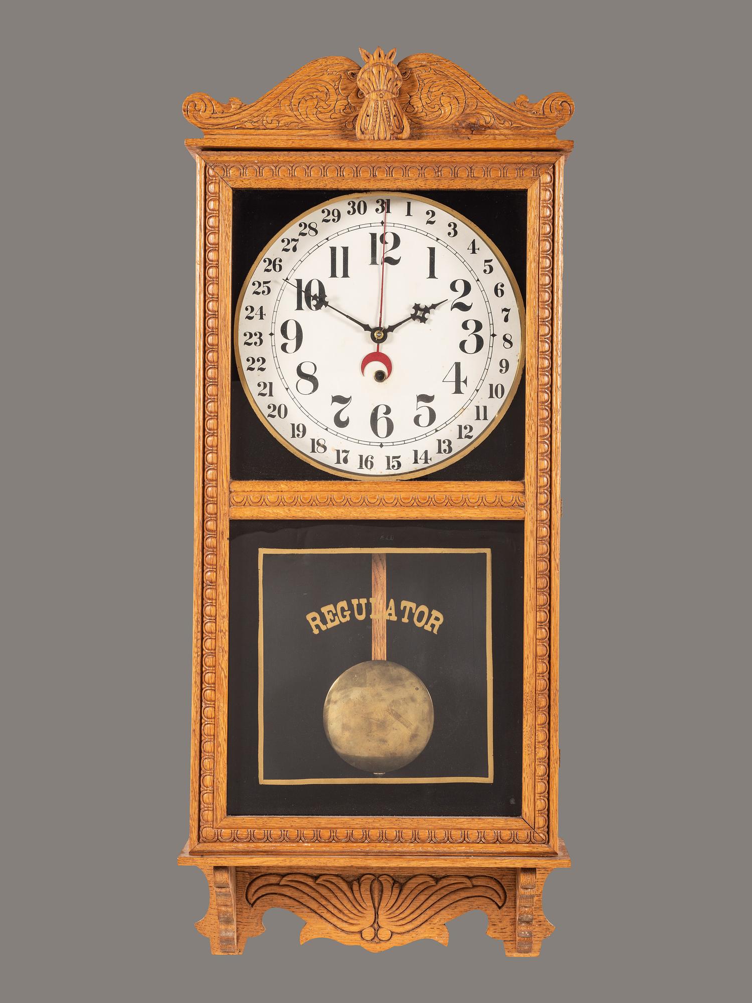 A Victorian Carved Oak Regulator Wall-Clock
