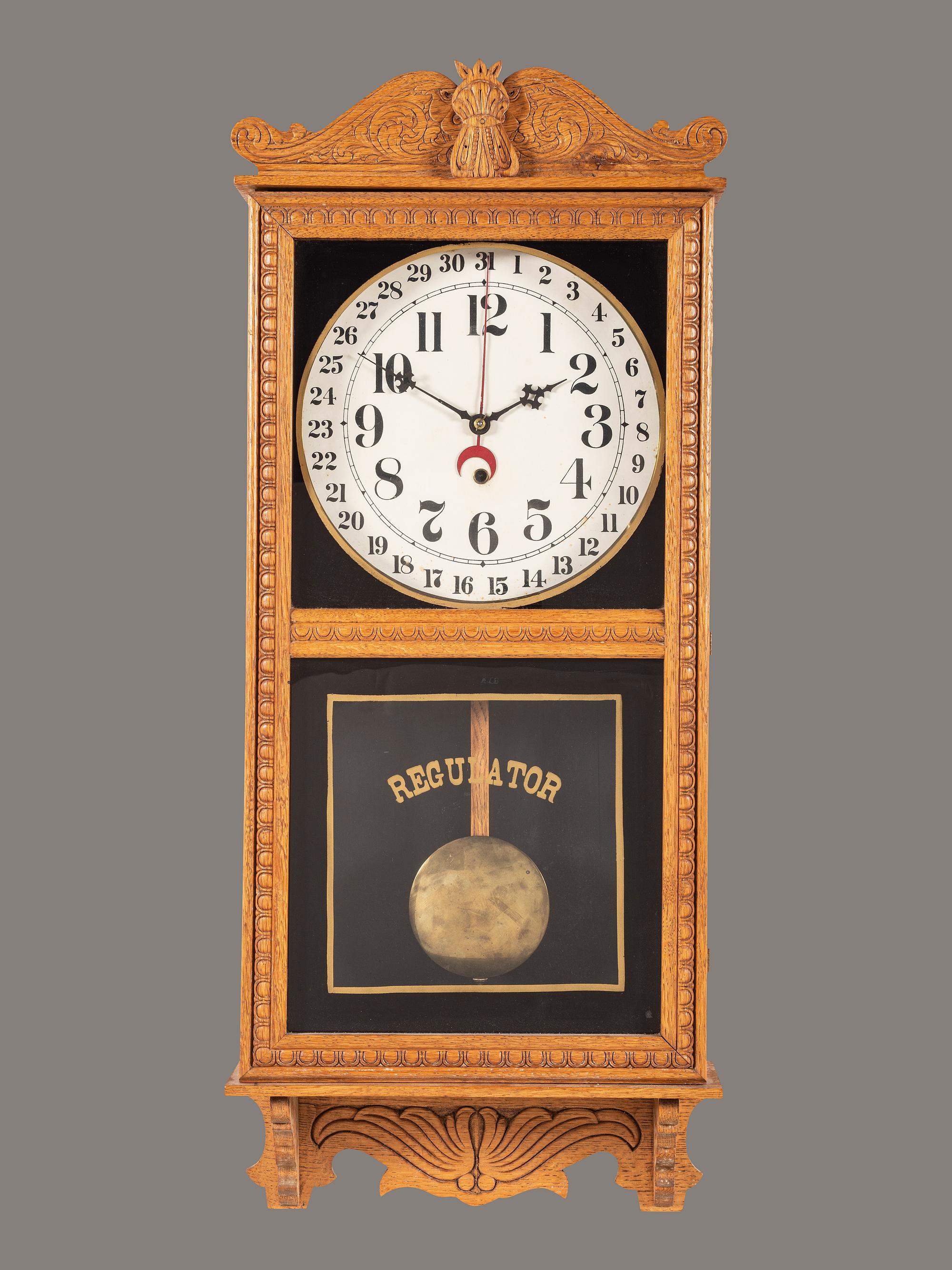 A Victorian Carved Oak Regulator Wall-Clock