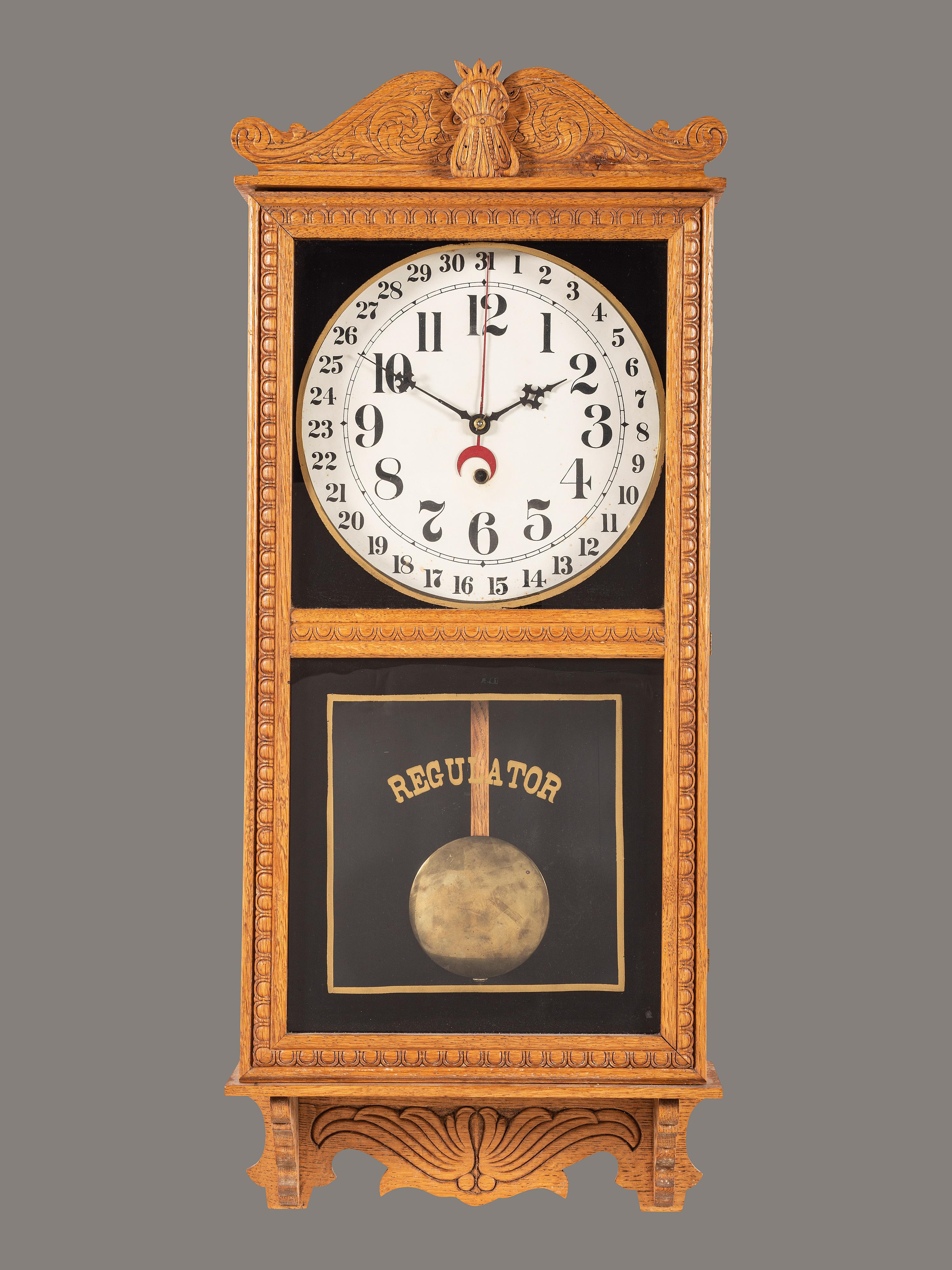 A Victorian Carved Oak Regulator Wall-Clock