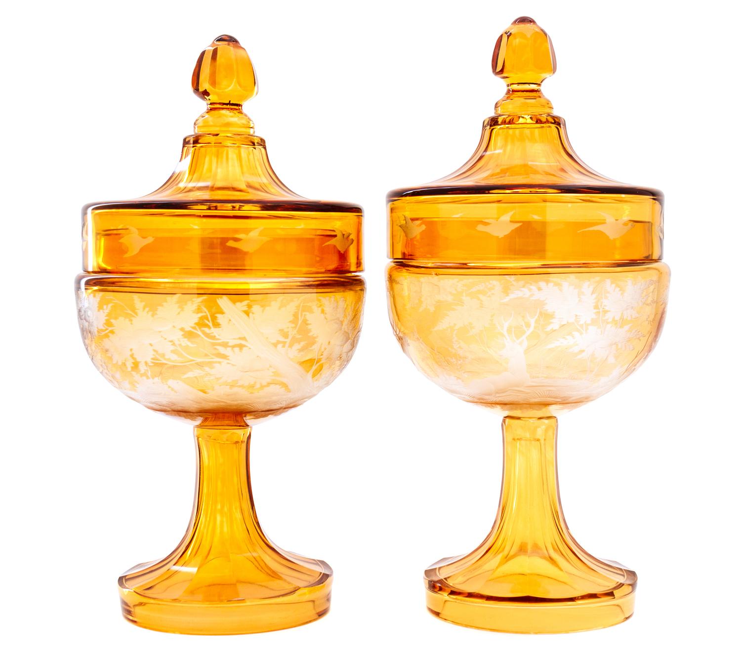 A Pair of Bohemian Etched Amber Glass Covered Urns Height 11 1/4 inches. — 20TH CENTURY