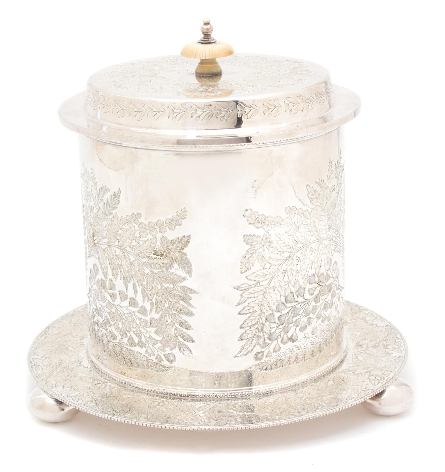 A Sheffield Silver Plate Biscuit Box, 19TH CENTURY, having engraved foliate decoration, with hinged lid.