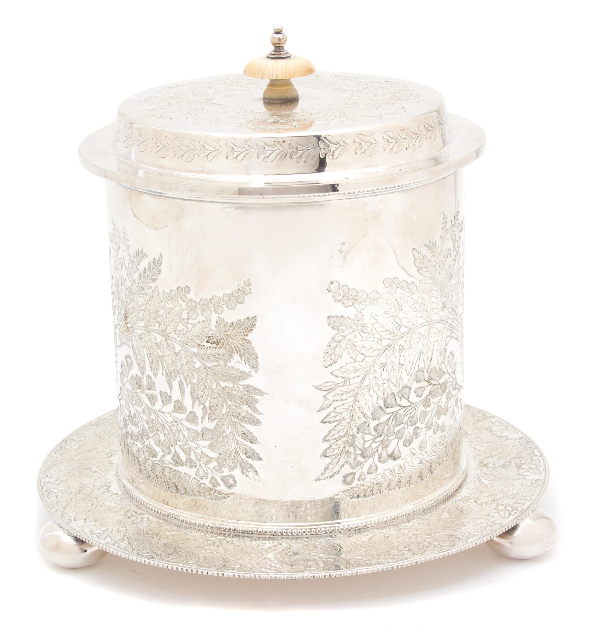 A Sheffield Silver Plate Biscuit Box, 19TH CENTURY, having engraved foliate decoration, with hinged lid.