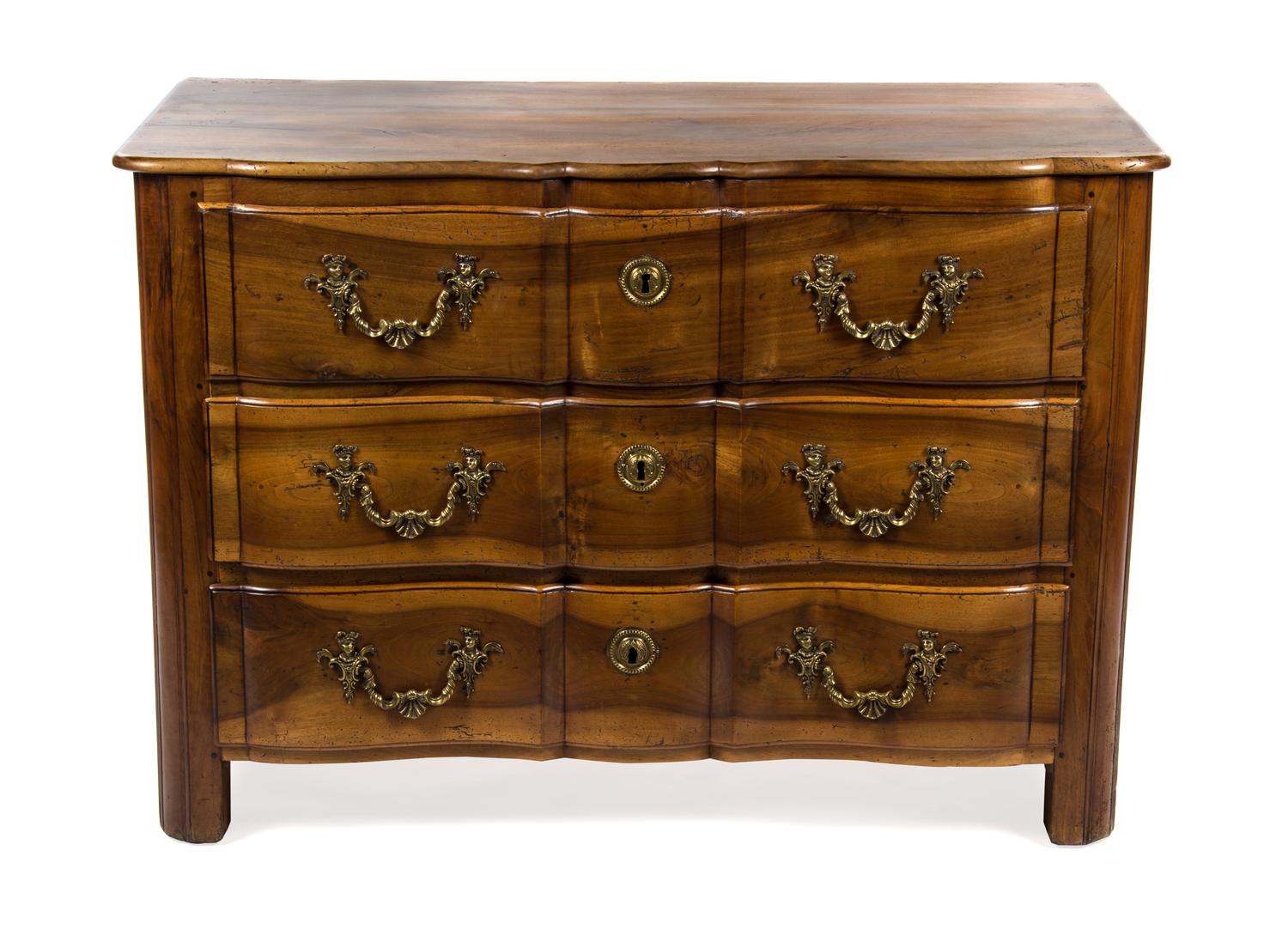 A French Walnut Chest of Drawers, 19TH CENTURY, Height 36 1/2 x width 52 1/2 x depth 26 inches. — 19TH CENTURY,