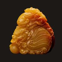 A finely-carved Chinese small yellow and russet soapstone dragon-fish, qilong, and pearl group 壽山石雕小把件