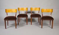 A Set of Four Swedish Birch and Walnut Klismos Chairs, Height 30 1/2 inches.