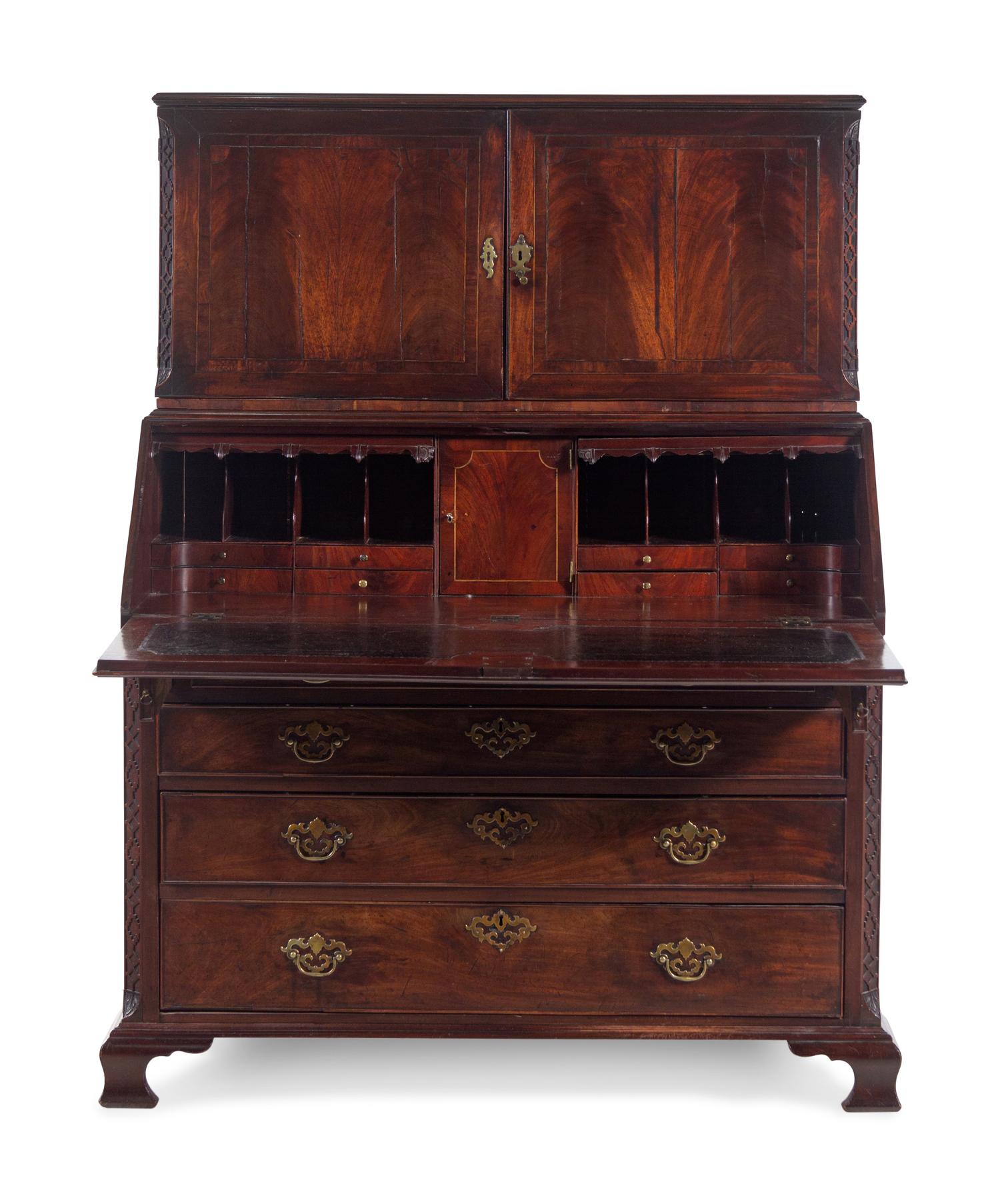 A George III Carved Mahogany Slant-Front Secretary Desk in the Chippendale Taste