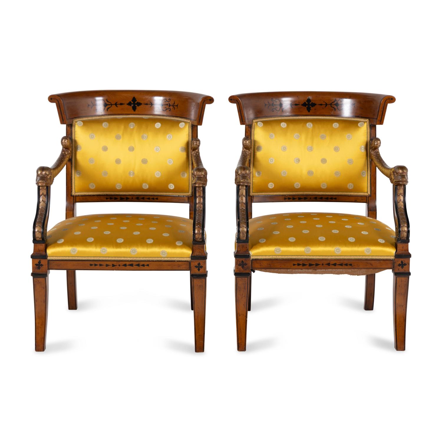 A Pair of Charles X Style Parcel-Gilt and Part Ebonized Armchairs
