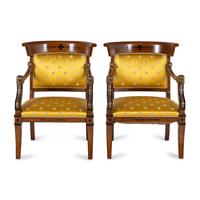 A Pair of Charles X Style Parcel-Gilt and Part Ebonized Armchairs