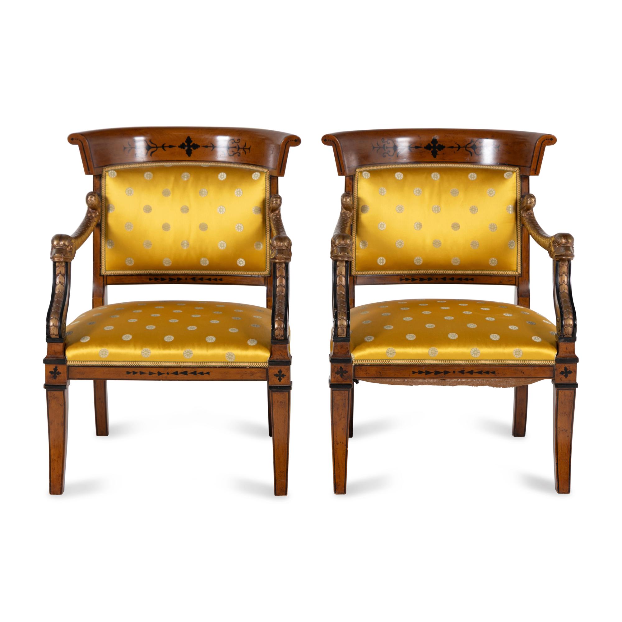 A Pair of Charles X Style Parcel-Gilt and Part Ebonized Armchairs