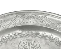 A Matched Pair of French Wriggle-Work Engraved Pewter Chargers, by M. Chocquell, Bergues, France, Circa 1750