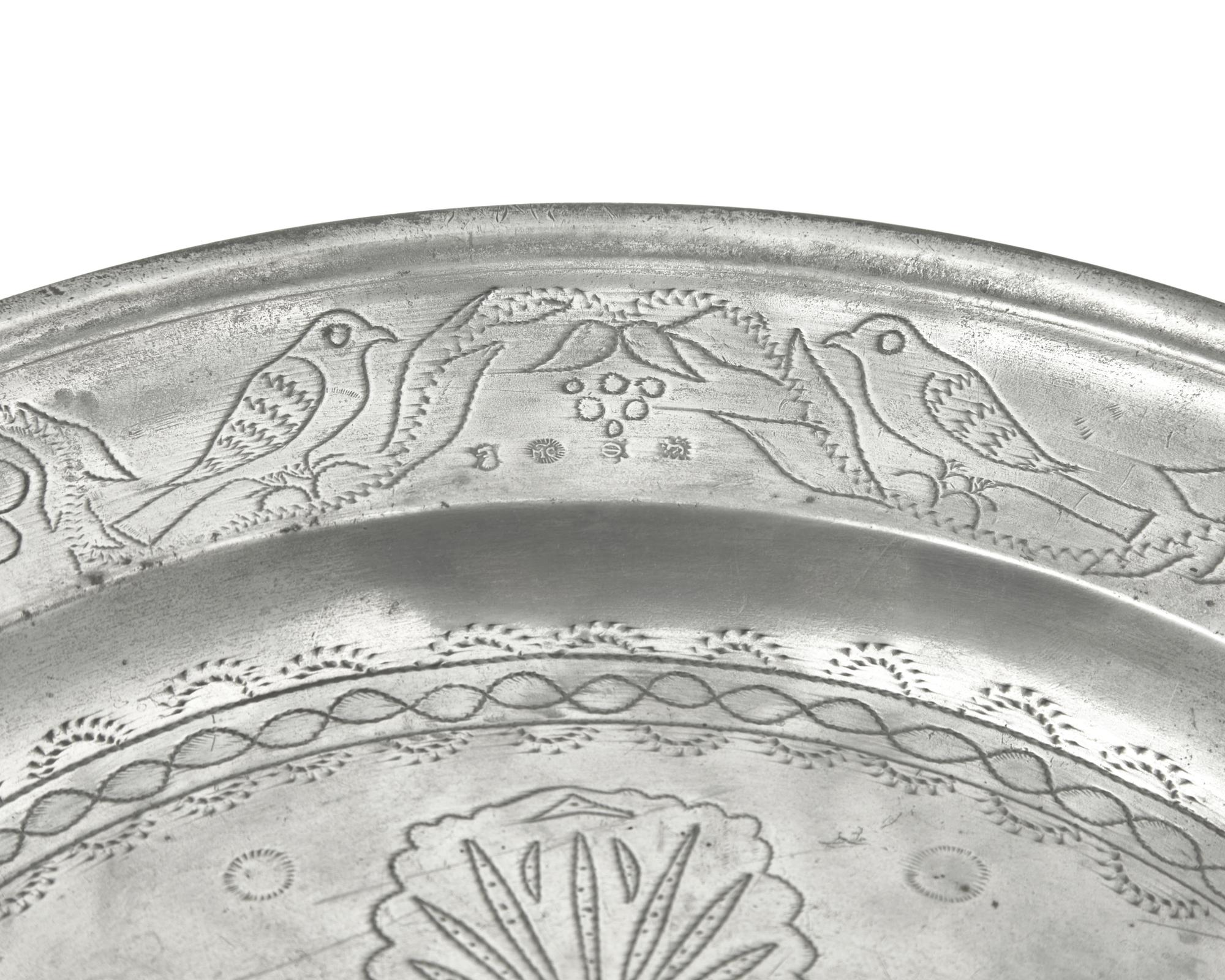 A Matched Pair of French Wriggle-Work Engraved Pewter Chargers, by M. Chocquell, Bergues, France, Circa 1750