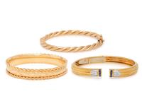 COLLECTION OF THREE YELLOW GOLD BANGLE BRACELETS