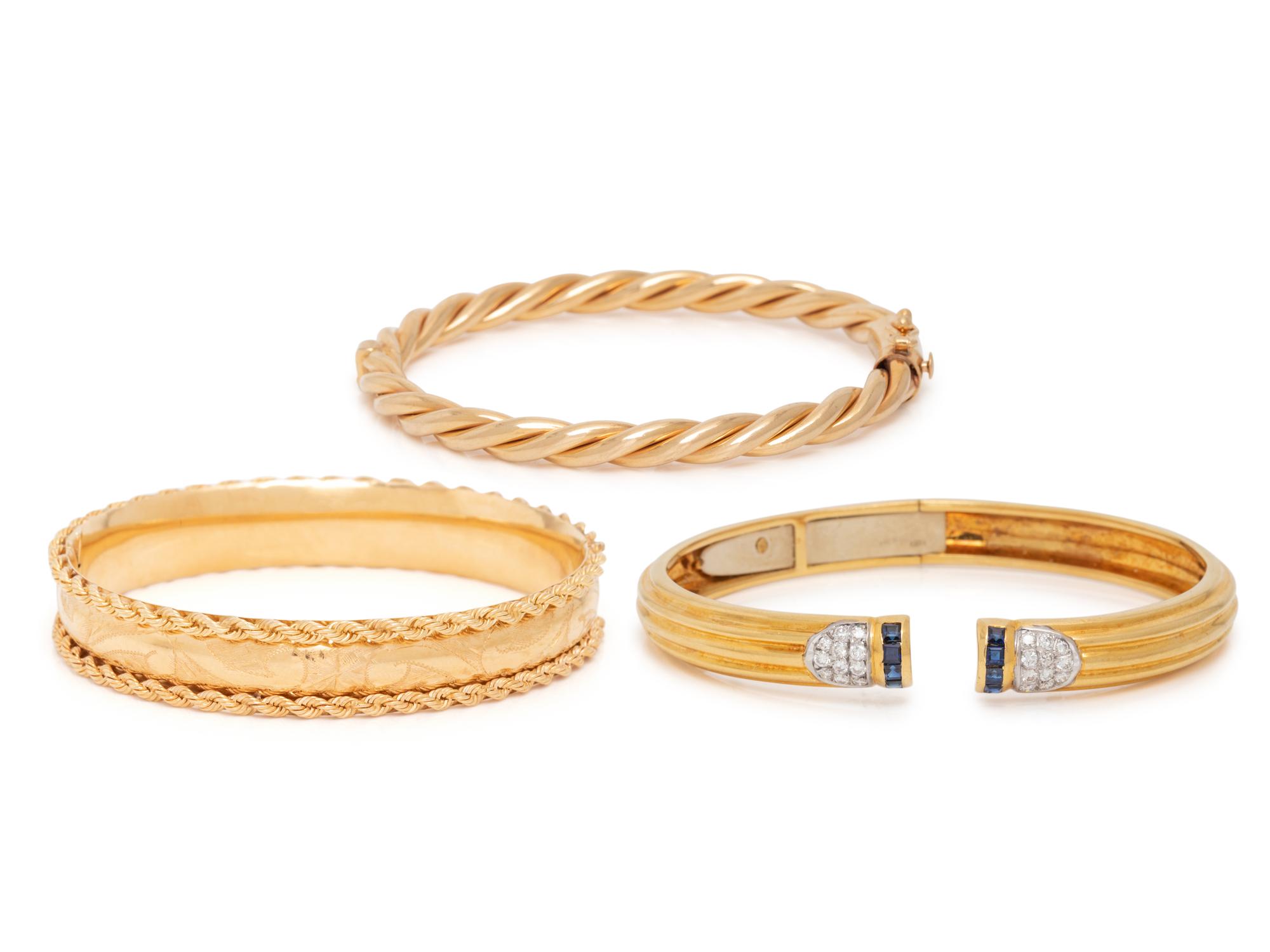 COLLECTION OF THREE YELLOW GOLD BANGLE BRACELETS