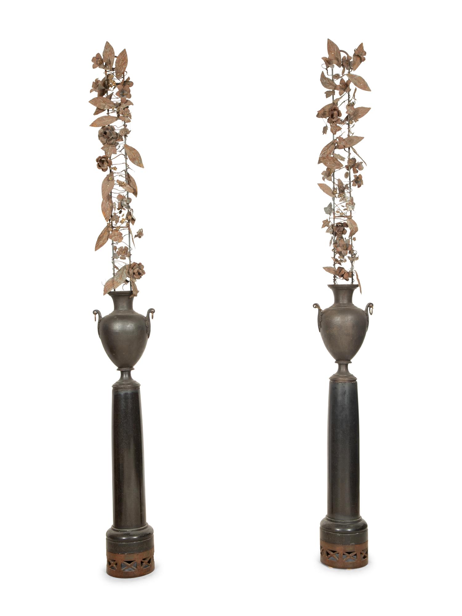 A Pair of French Bronze Urns with Tole Trellises of Floral Vines on Marble Pedestals