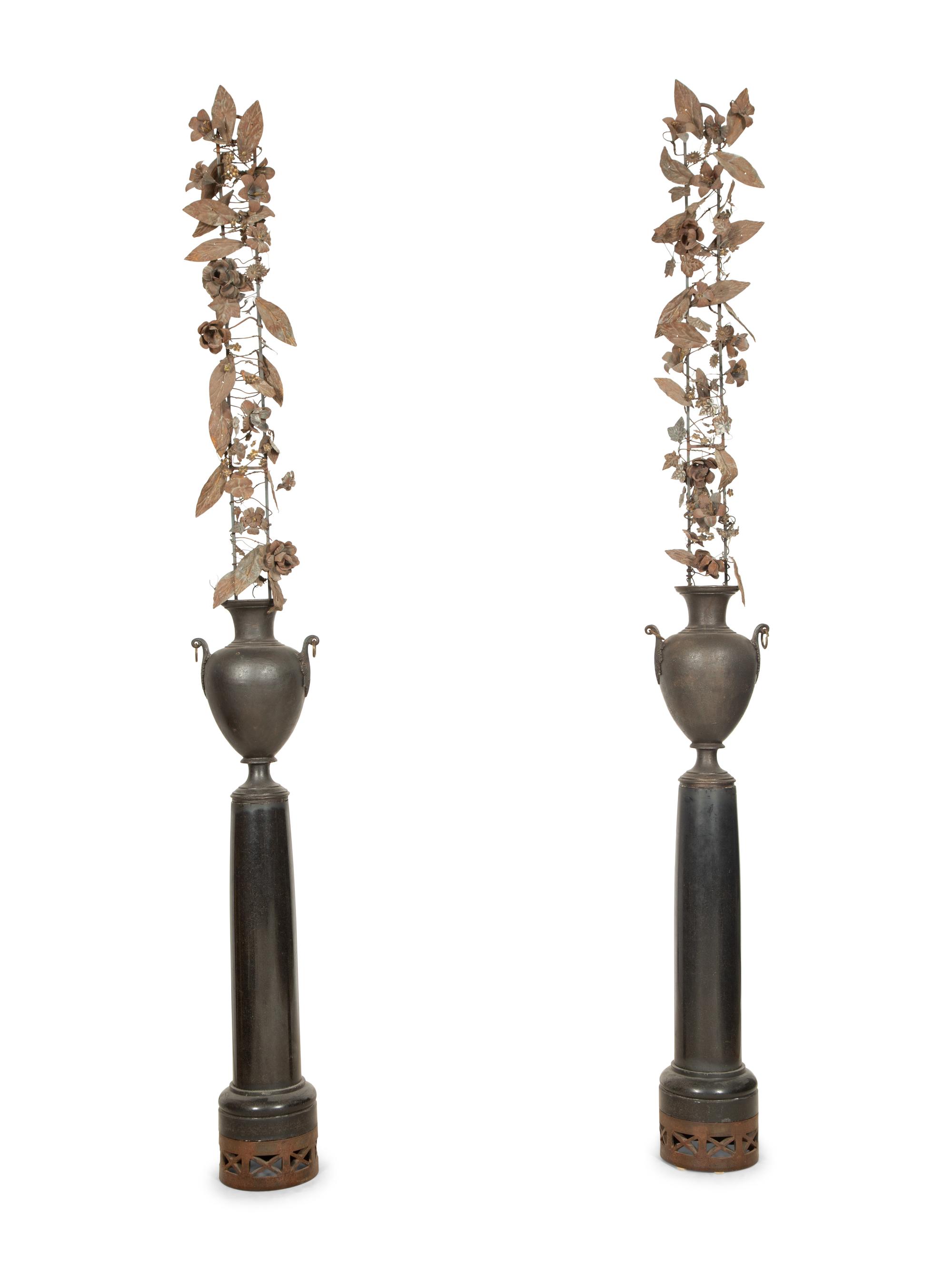 A Pair of French Bronze Urns with Tole Trellises of Floral Vines on Marble Pedestals