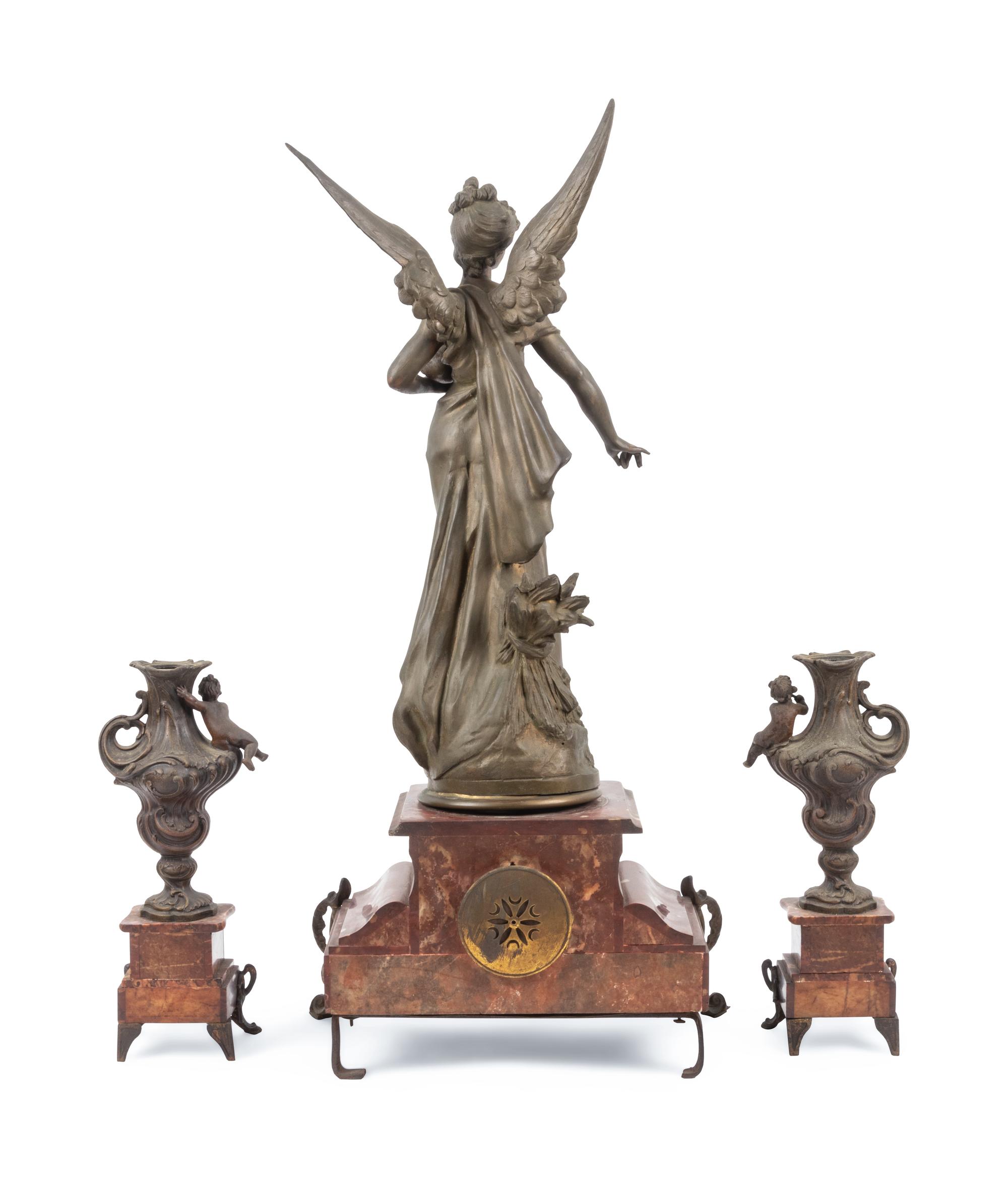 A French Cast Metal and Marble Clock Garniture