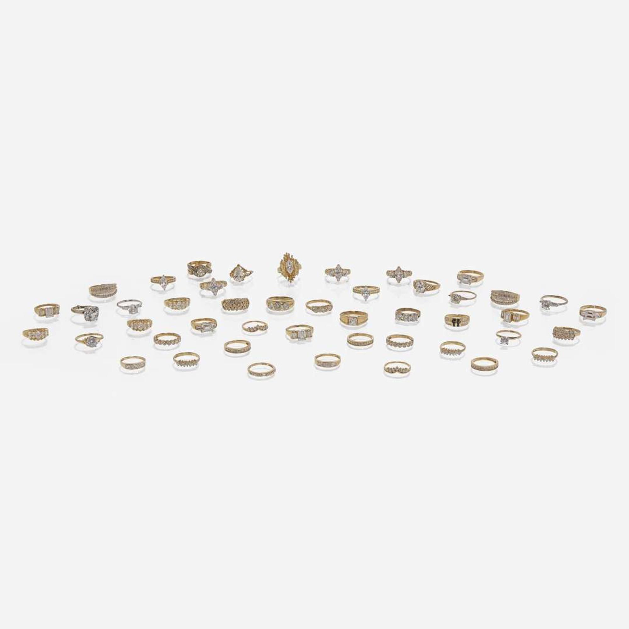 Large Collection of 14K Gold and Colorless Stone Rings