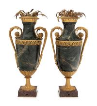 A Pair of Gilt Bronze Mounted Marble Urns on Porphyry Bases