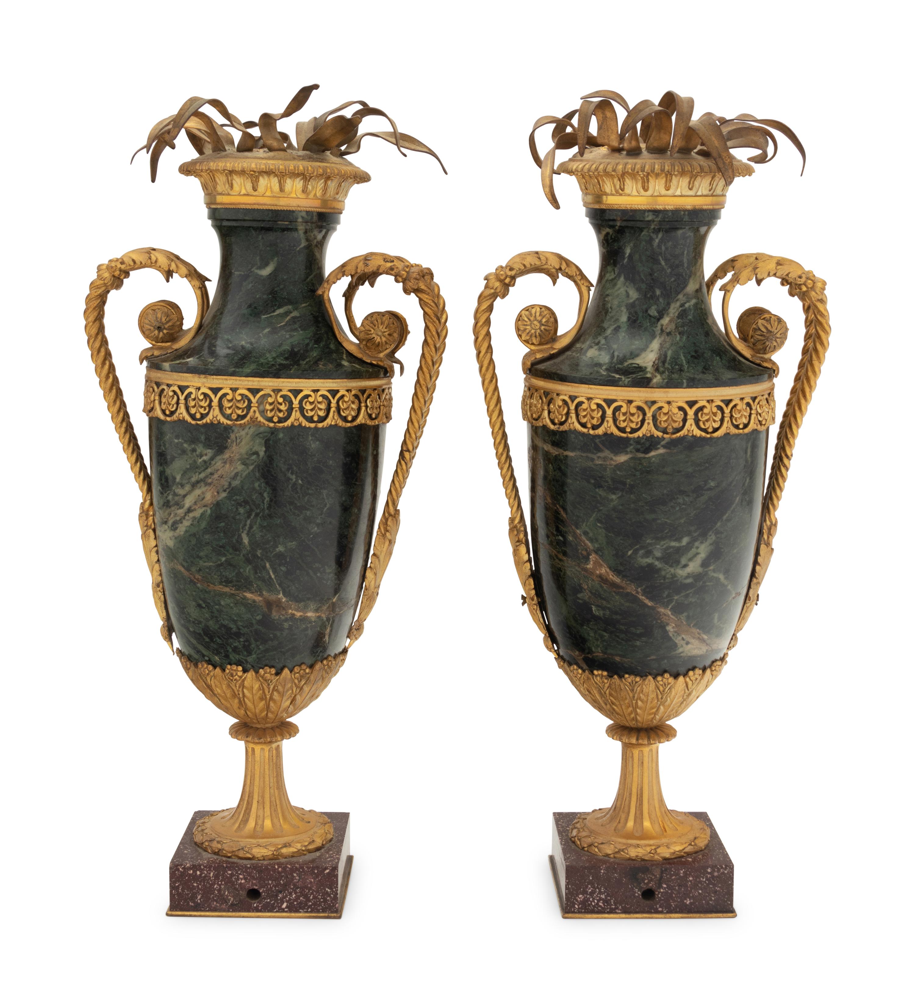 A Pair of Gilt Bronze Mounted Marble Urns on Porphyry Bases