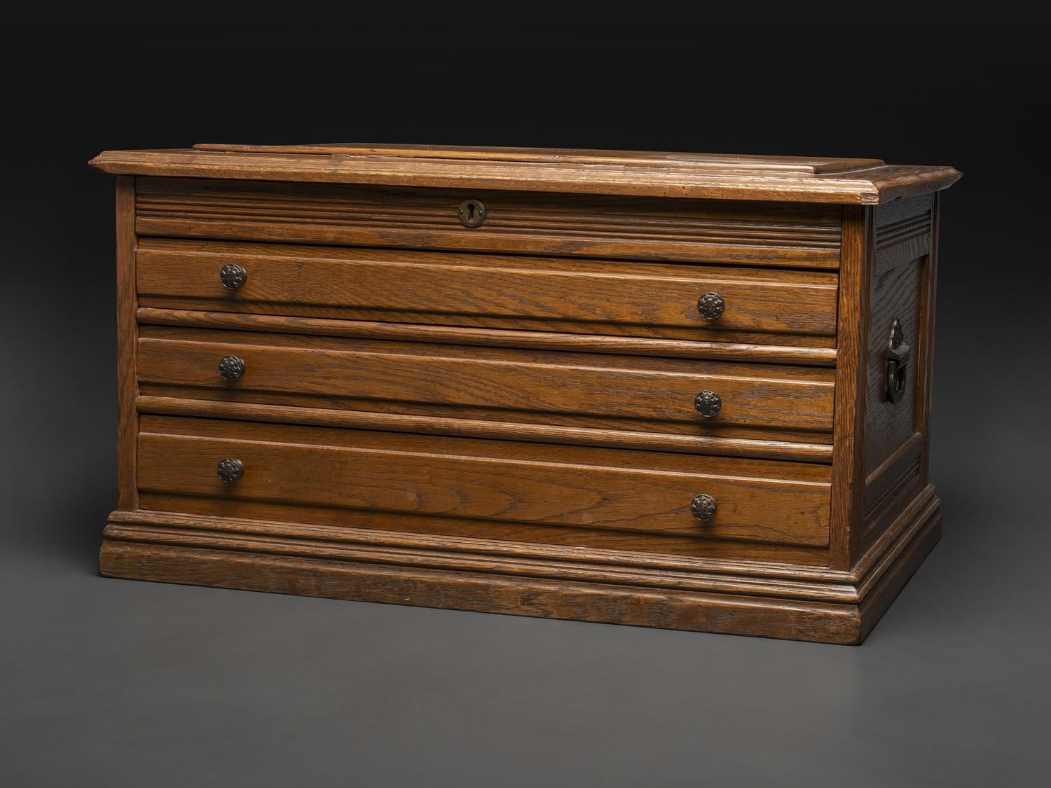 An Oak Three-Drawer Apothecary Cabinet with Specimen Tins