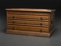 An Oak Three-Drawer Apothecary Cabinet with Specimen Tins