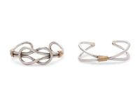 A Collection of Silver and Yellow Gold Cuff Bracelets,