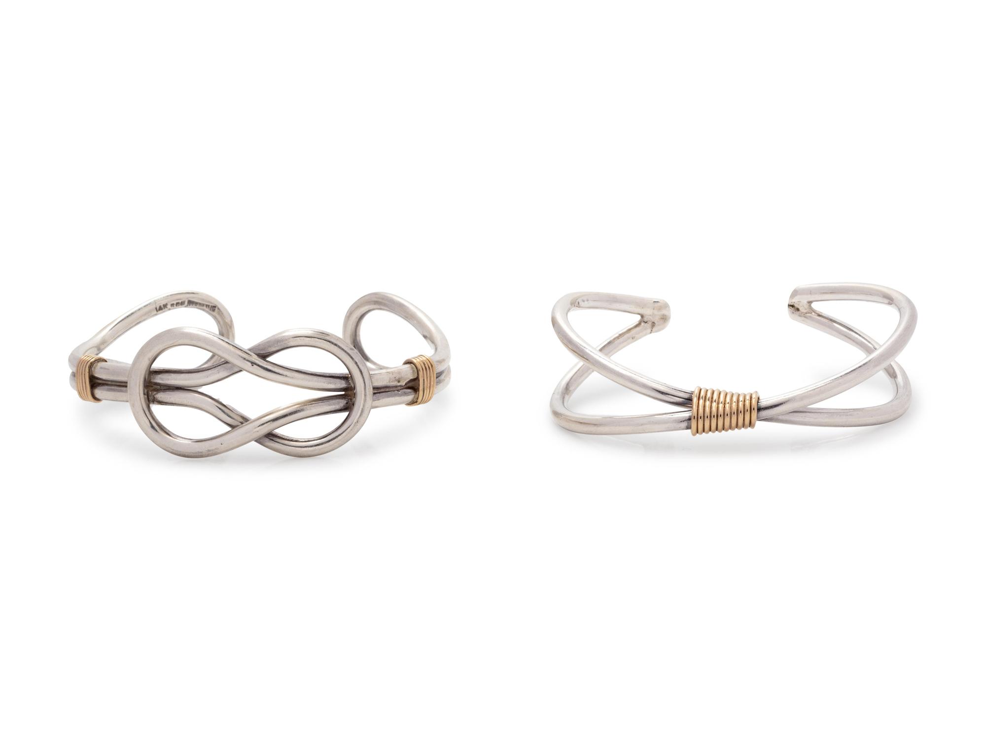 A Collection of Silver and Yellow Gold Cuff Bracelets,