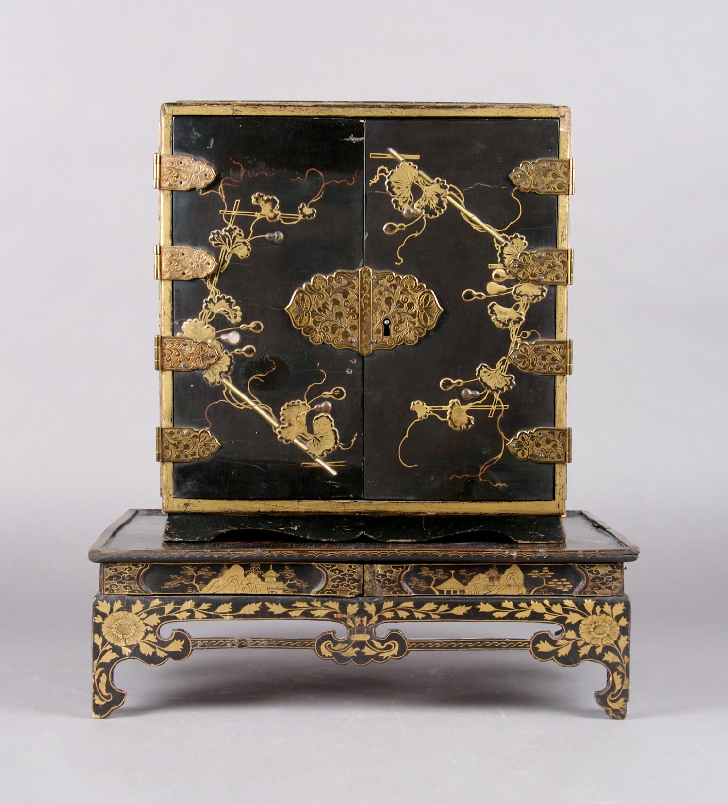 A Chinese Black Lacquered Diminutive Cabinet on Stand, Height 15 3/4 inches.