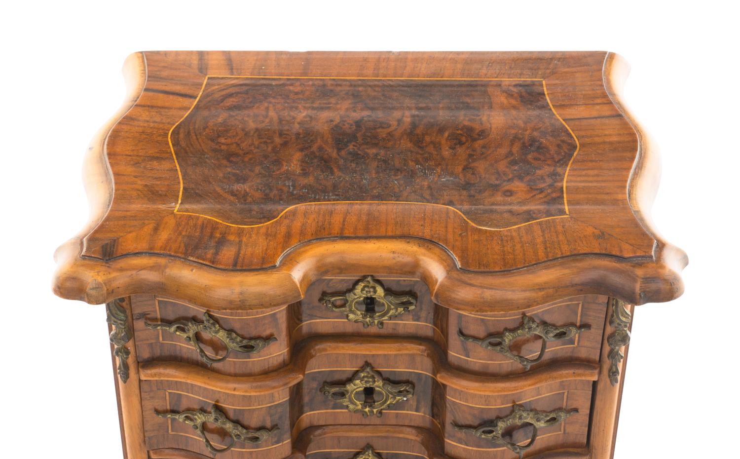 A Louis XV Style Walnut and Kingwood Diminutive Chest of Drawers