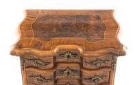 A Louis XV Style Walnut and Kingwood Diminutive Chest of Drawers