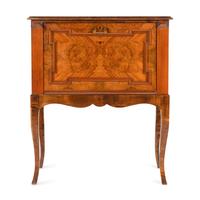 A Continental Carved and Figured Walnut Bureau