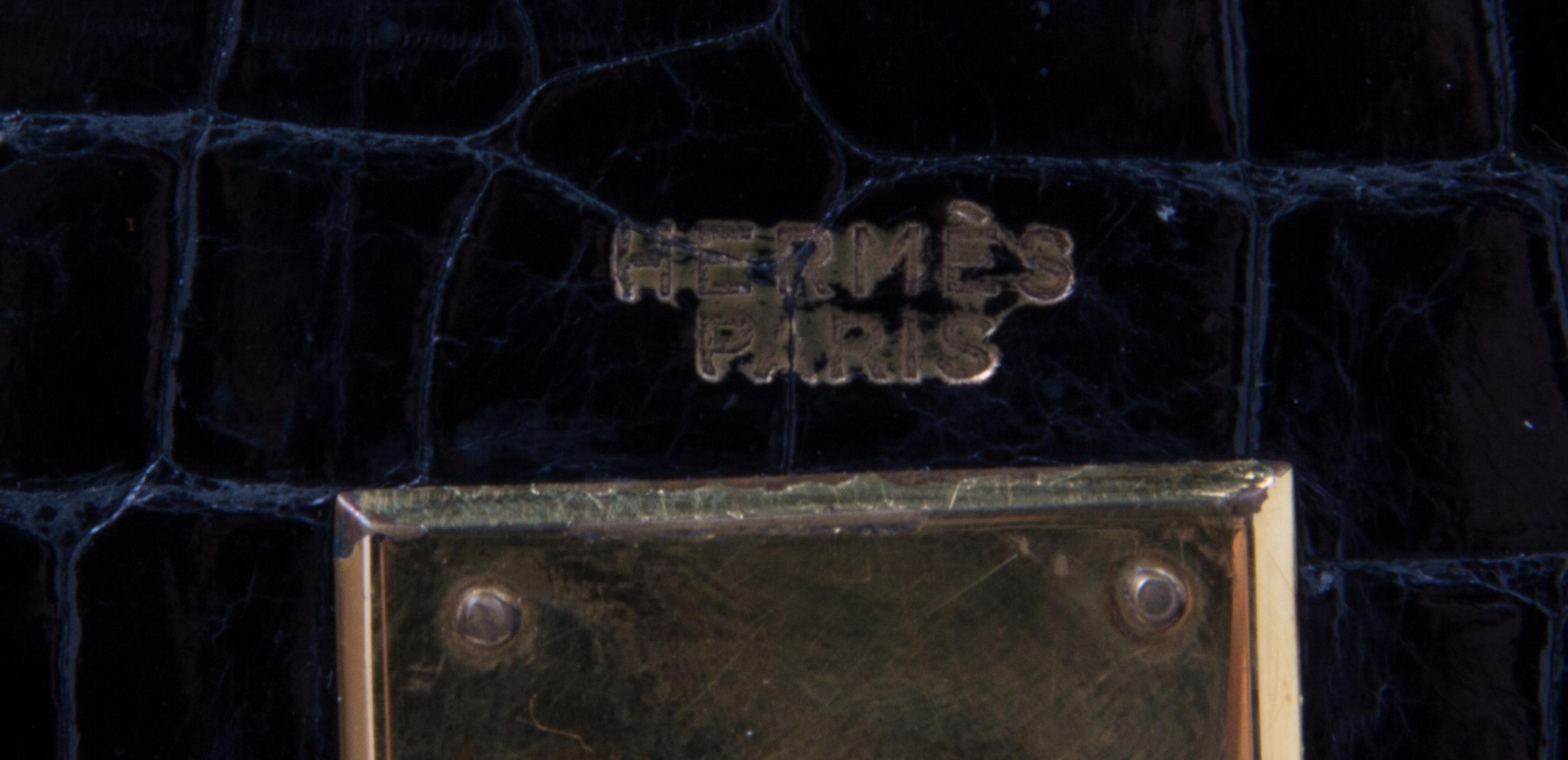 An Hermes 34cm Black Porosus Crocodile Kelly Handbag, 13" x 10" x 5".